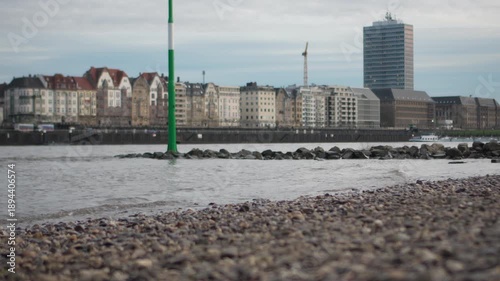 Calm Rhine River with Düsseldorf city skyline in the background