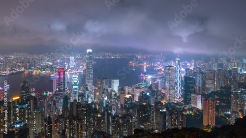 Wallpaper Mural A dynamic aerial time-lapse capturing the glowing light trails of night traffic flowing through illuminated city streets and highways. Torontodigital.ca