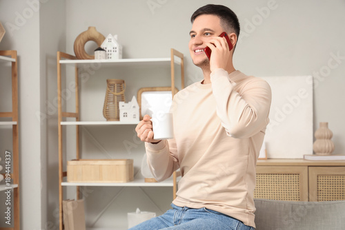 Handsome young man with mug...