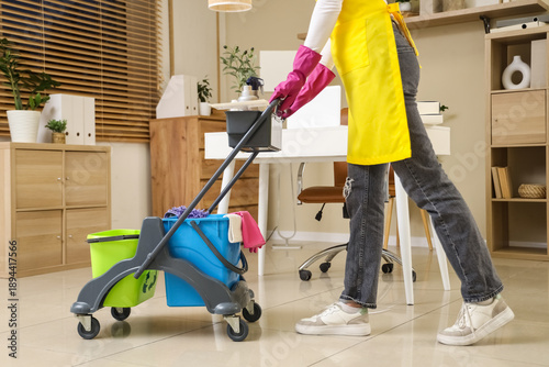 Female janitor with trolley...