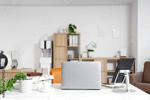 Workplace with laptop, tabl...