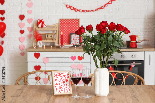 Table with wine, roses and ...