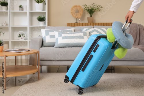 Young woman with suitcase a...
