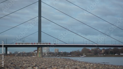 U-Bahn and traffic on Oberkasseler Bridge over the Rhine River in Düsseldorf