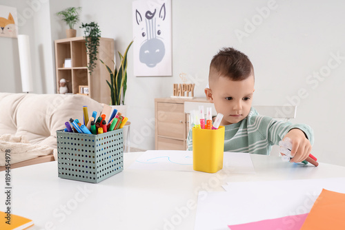 Funny little boy drawing wi...