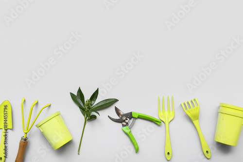 Gardening tools on grey bac...