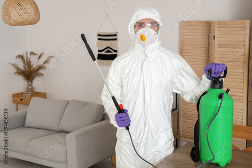 Male worker wearing hazmat ...