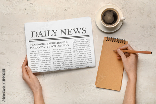 Female hands with newspaper...