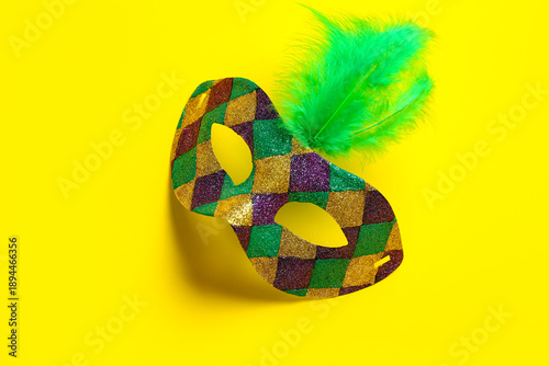 Shiny carnival mask with fe...