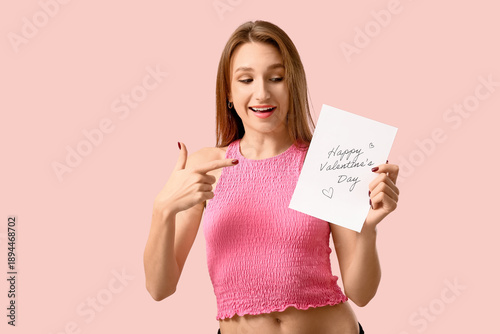 Beautiful young woman point...