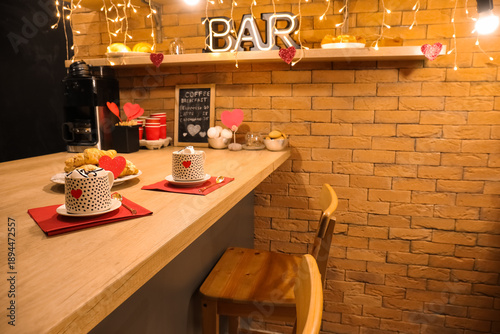 Bar counter with cups of ho...