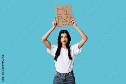 Young woman holding cardboa...