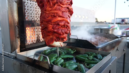 Cinematic Slow Motion Al Pastor on a Mexican Street Food Spit