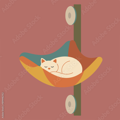 A serene cream-colored cat sleeps curled in a colorful fabric hammock, suspended from a vertical post by two suction cups against a muted red wall.