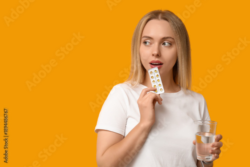 Young woman with vitamin A ...