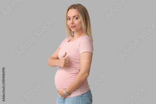 Young pregnant woman after ...