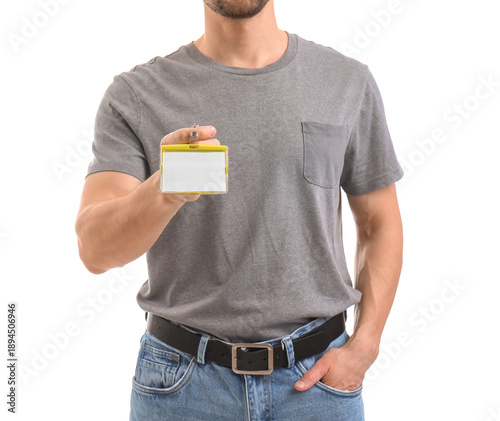 Young man with blank badge ...