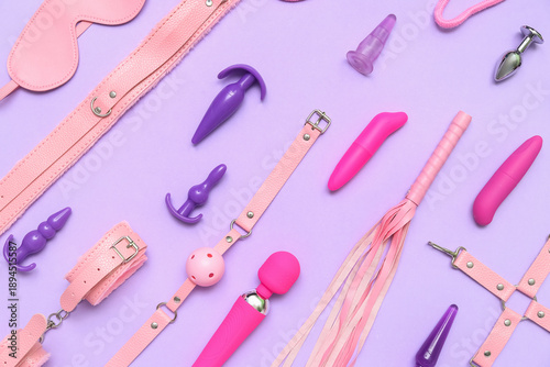 Different sex toys on lilac...