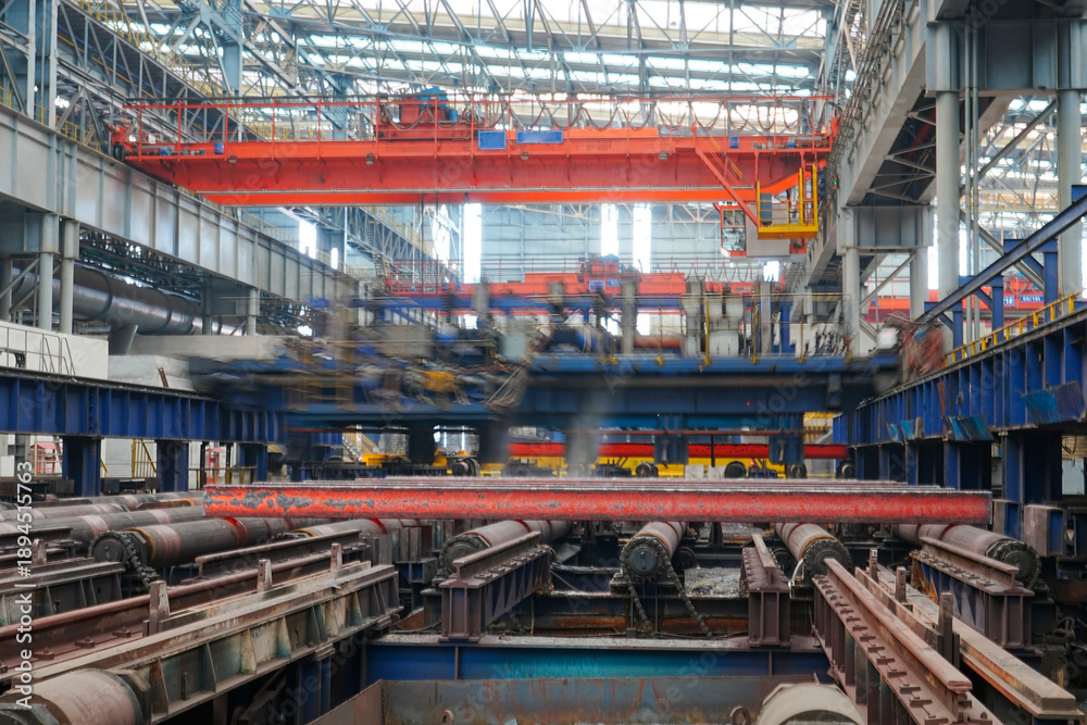 Obraz premium The fiery steel billet, the core moment of the rolling mill production line