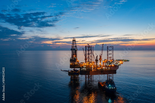 Konstfotografi Aerial view of offshore jack up rig in a shipyard during sunset for oil and gas exploration and production