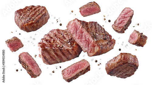 Εκτύπωση καμβά close-up overhead view of a selection of perfectly grilled steak cuts, seasoned with coarse salt and cracked black pepper, isolated on a transparent background