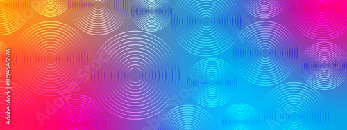 Beautiful abstract pattern of multi colored concentric line circles over a smooth pink blue and yellow gradient backdrop