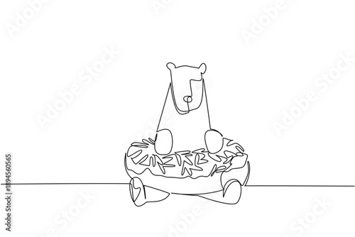 Continuous line drawing of polar bear shows cute arctic animal lying inside glazed donut for fancy pastry concept. Unique design features antarctica creature for an international food day theme in art