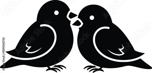 Two birds kissing each other