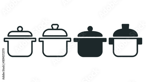 Pots with lids in black and white kitchen