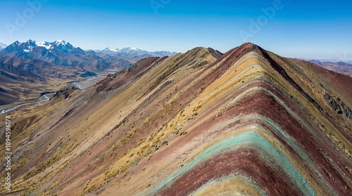 Scenic Aerial View of Vinicunca Rainbow Mountain with Striking Geological Formations on Sunny Day Clear Blue Sky in Cusco Region Peru Andes Mountains