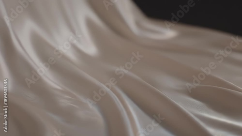 Elegant flowing fabric in soft neutral tones creates a beautiful aesthetic.