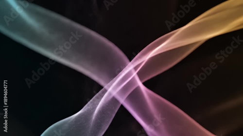 Abstract smoke art with colorful gradients on a dark background for design.