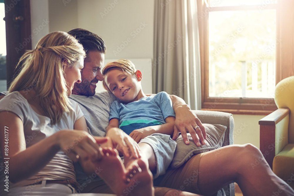 Obraz premium Parents, smile and kid relax on couch with care, connection and love for bonding together on weekend. Happy, mother and father chill in home with boy child, trust and affection for family support.