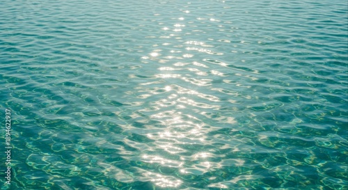 Crystal Clear Water Surface with Captivating Sunlight Reflections Creating a Mesmerizing Natural Pattern of Shimmering Light