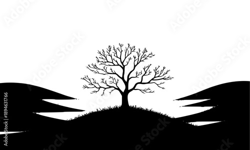 Dramatic black and white landscape silhouette featuring a bare tree on a grassy hill with rolling hills in the background perfect for nature conservation and environmental concepts.