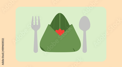 A green napkin with a red heart on a table setting with a fork and spoon.
