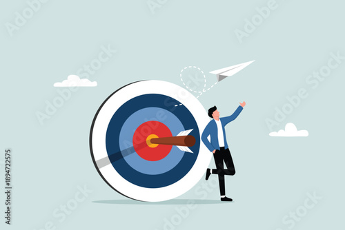 Business goals, targets and determination to achieve success, motivation to achieve goals, the concept of a confident entrepreneur standing with an arrow hitting the target right in the middle.