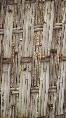 old cement wall background, and dark brown woven bamboo background