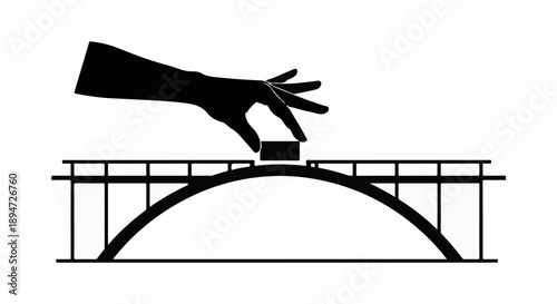 Hand placing final piece on bridge construction, symbolizing completion and connection