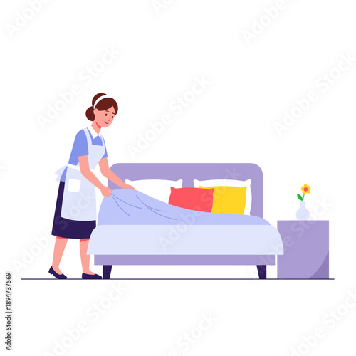Female housekeeper making bed in a modern bedroom setting  