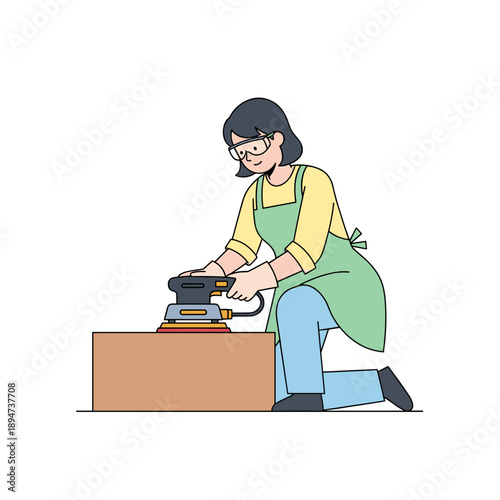 Woman using electric sander on wooden box while kneeling indoors  