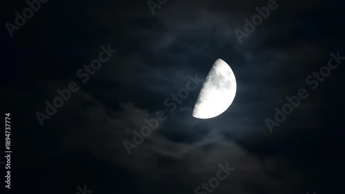 Half moon in cloudy sky at night celestial nature scenery