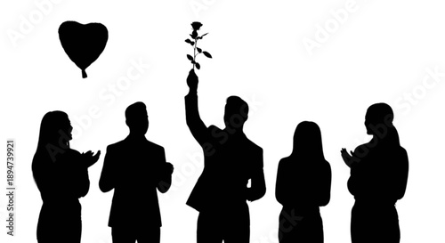 A man holding a rose in celebration with a heart balloon and applauding people around him