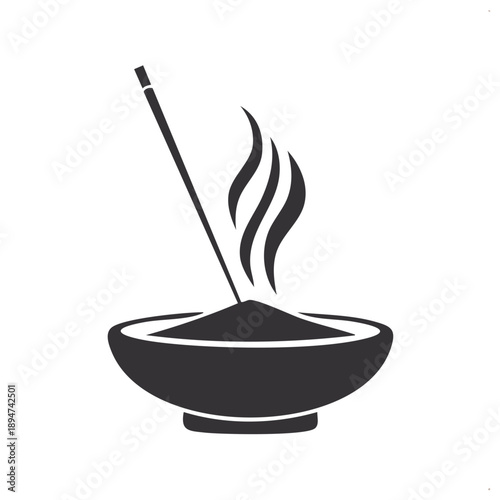 Aromatic incense stick burning in a decorative bowl with rising smoke for spiritual wellness