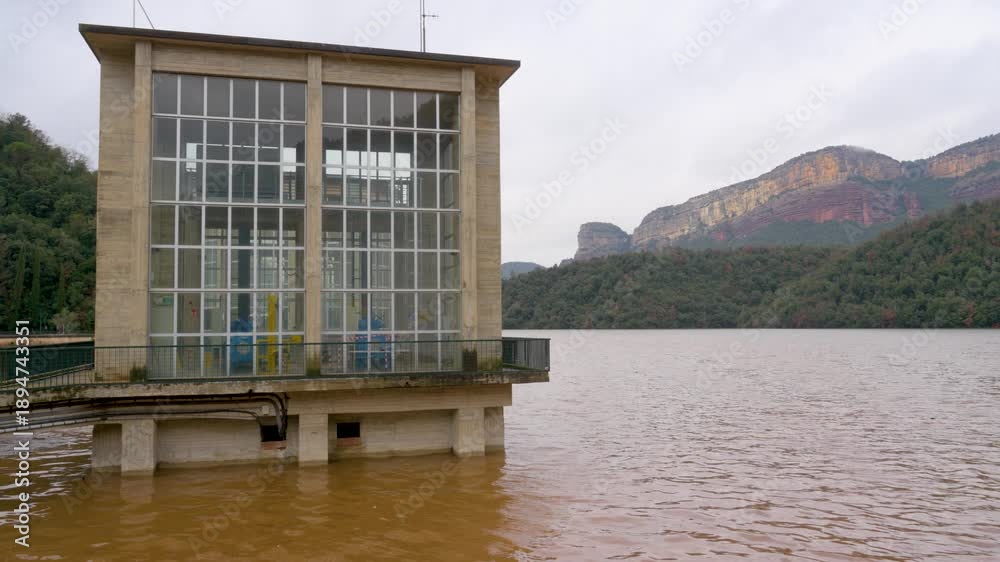 Dam Control Building Sau pantano overflowing, january 2026 concrete dam control building ...