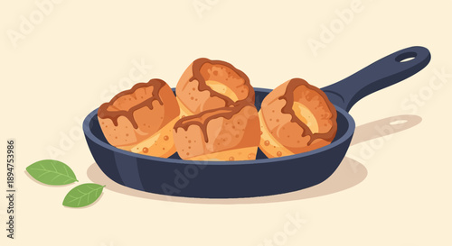 Four baked goods with chocolate drizzle in a pan with leaves