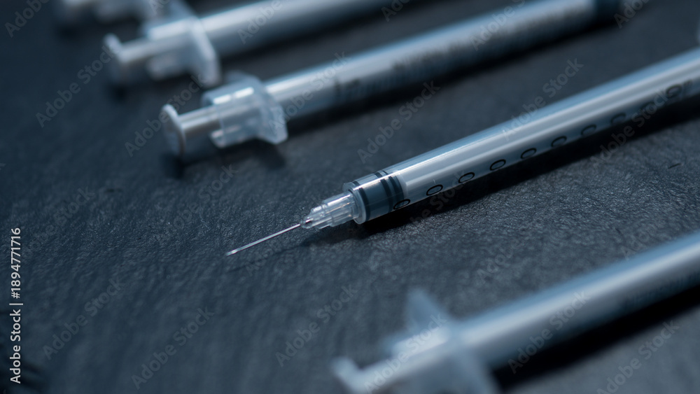 Naklejka premium Insulin Syringes Representing Chronic Injection Therapy and Diabetes Treatment