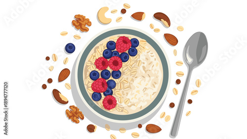 Healthy bowl of oatmeal porridge topped with fresh raspberries and blueberries surrounded by various nuts and grains.