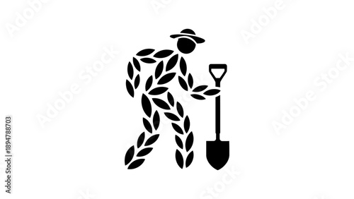 A gardener figure made of leaves holds a shovel.