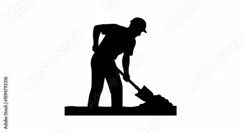 Silhouette of a construction worker digging with a shovel.
